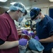 USS George Washington Sailors conduct dental operation