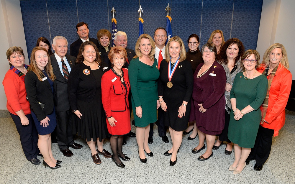 Secretary of the Air Force Deborah Lee James presents Fisher Distinguished Civilian Humanitarian Award