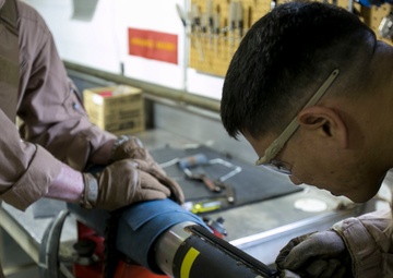 Steady hands: EOD technicians disarm Griffin missile