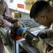 Steady hands: EOD technicians disarm Griffin missile