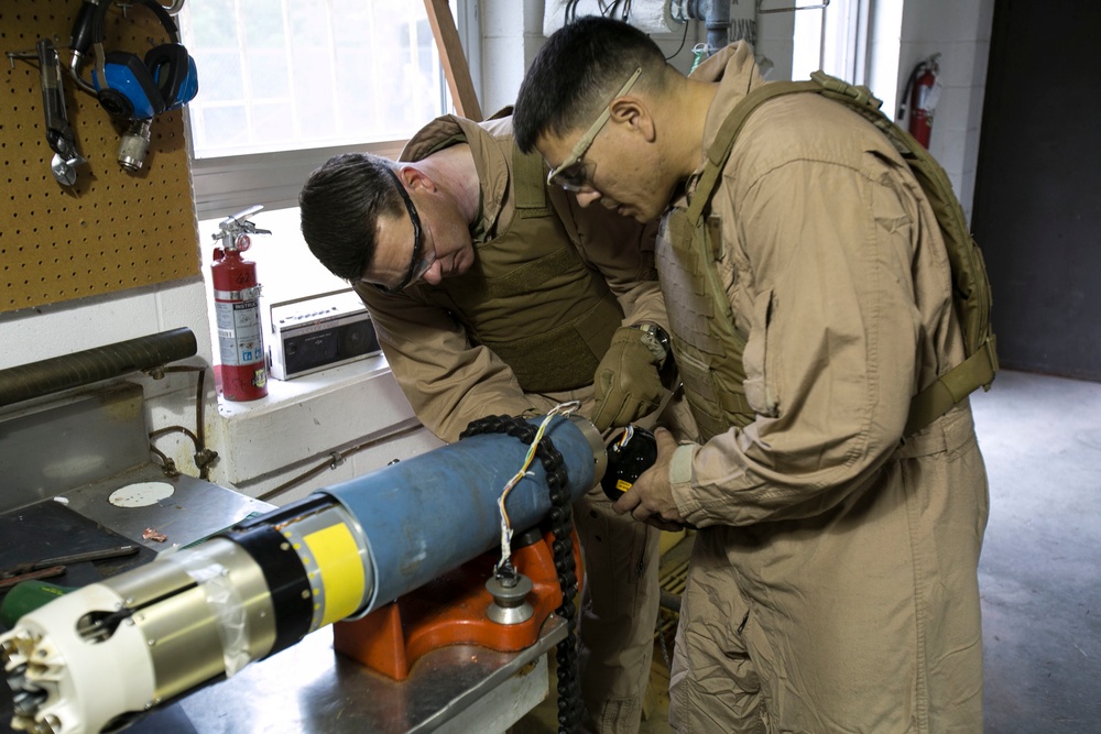 Steady hands: EOD technicians disarm Griffin missile