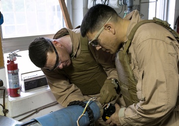 Steady hands: EOD technicians disarm Griffin missile