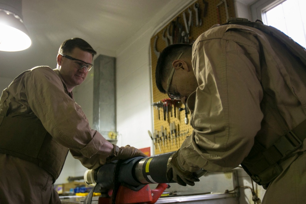 Steady hands: EOD technicians disarm Griffin missile