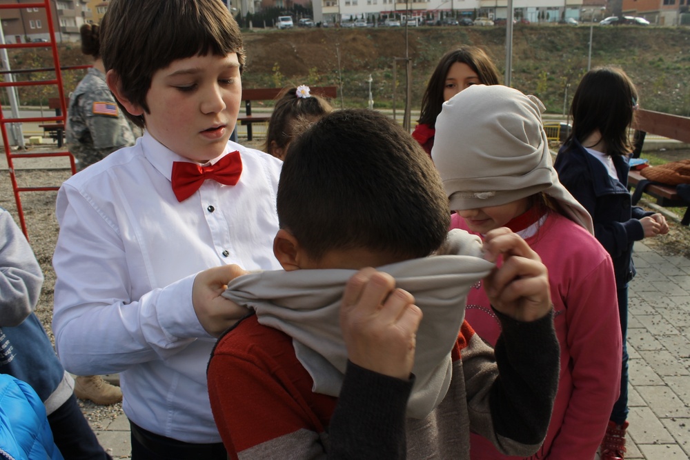 US Soldiers conduct team-building games in Kosovo