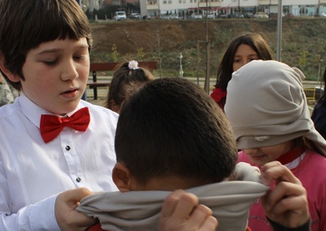 US Soldiers conduct team-building games in Kosovo