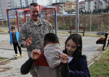 US Soldiers conduct team-building games in Kosovo