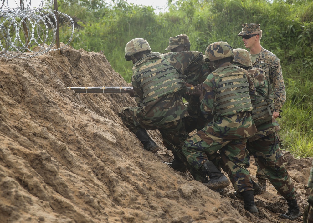 Breaching the barrier: Ugandans, U.S. Marines blow through obstacles