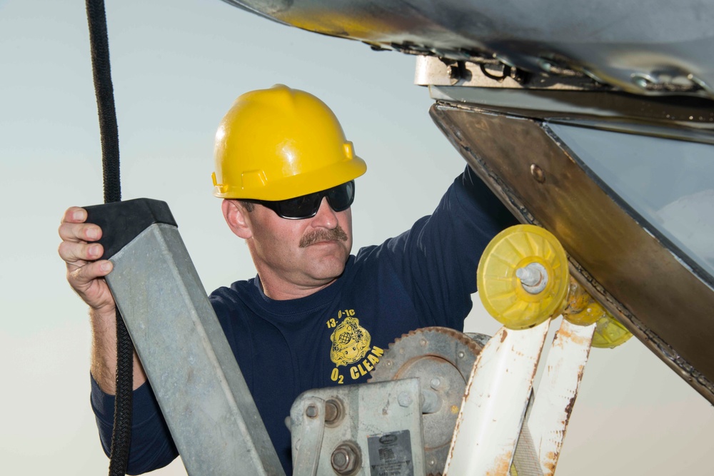 Navy diver loads boat