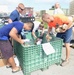 Airmen spread holiday cheer during Operation Christmas Drop sorting party