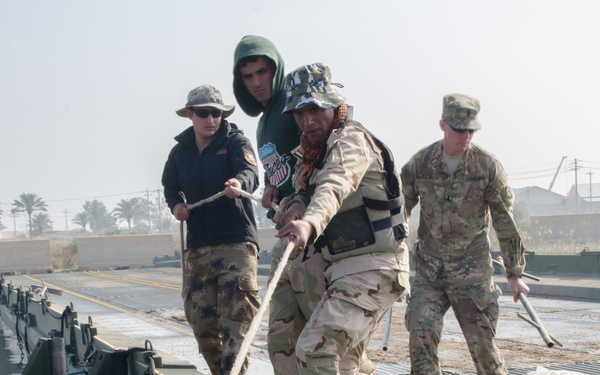 Iraqi engineers assemble float bridges