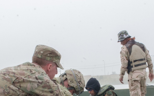 Iraqi engineers assemble float bridges