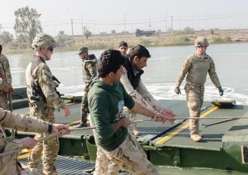 Iraqi engineers assemble float bridges