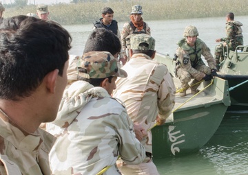 Iraqi engineers assemble float bridges