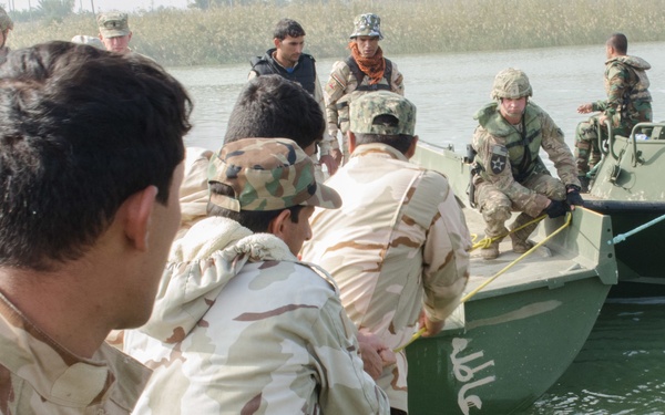 Iraqi engineers assemble float bridges