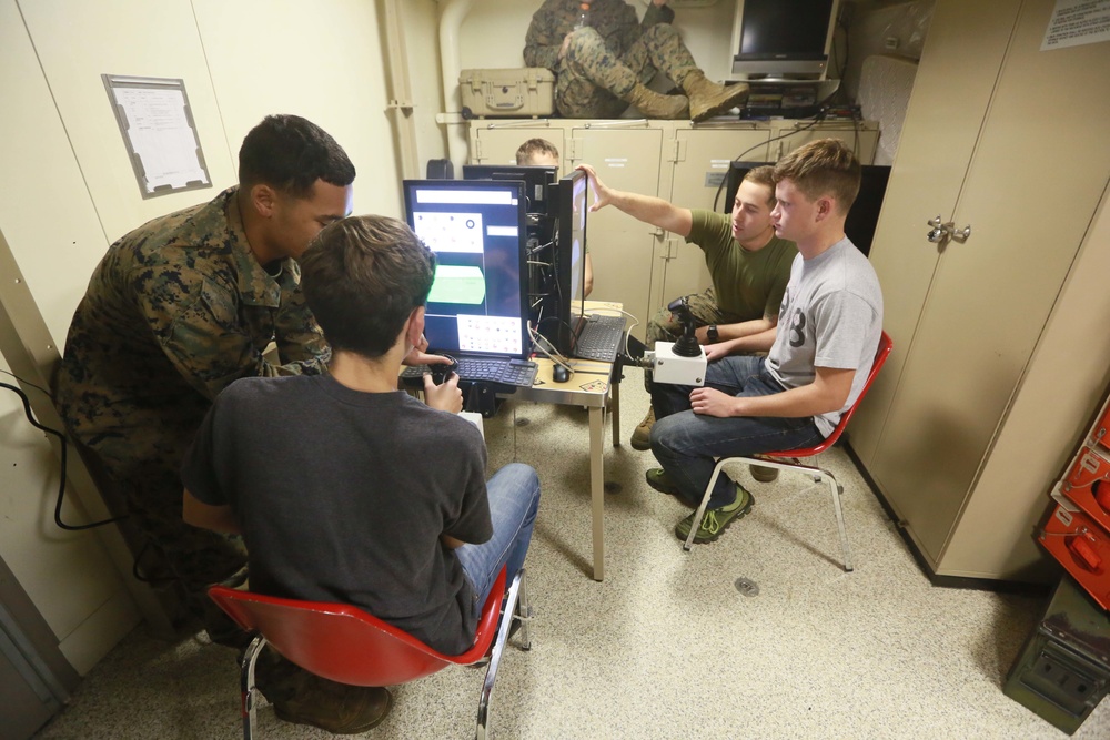 U.S. Marines and family members operate LAV simulator