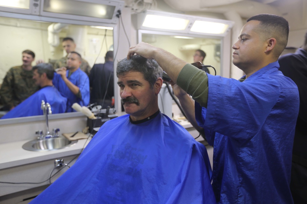 U.S. Marines experience the USS Anchorage barbershop