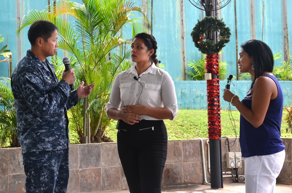 Capt. H.B. Le, Commodore, Destroyer Squadron SEVEN, and Sapna Lahiff role play with an actor from Pure Praxis during Sexual Assault and Prevention training at the Terror Club amphitheater in Singapore Dec. 15