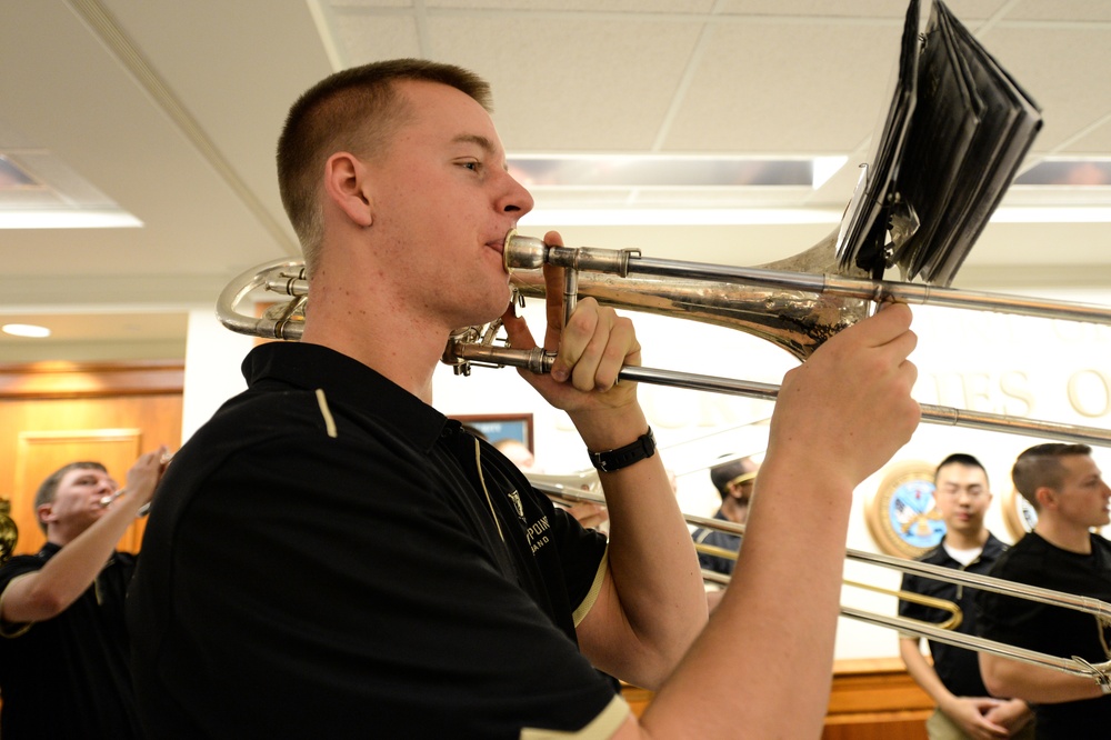 The Army pep rally band plays in the Pentagon halls before the upcoming Army-Navy football game this Saturday