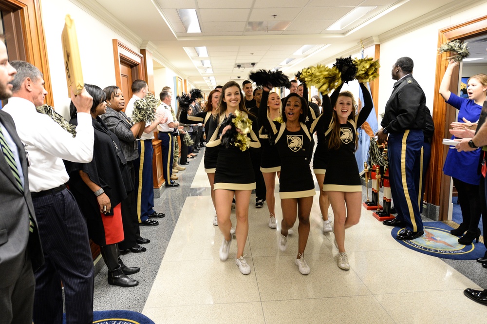 Cheerleaders lead a pep rally through the halls of the Pentagon cheering on their team for the upcoming Army/Navy