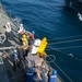 Marines and Sailors work together during replenishment-at-sea