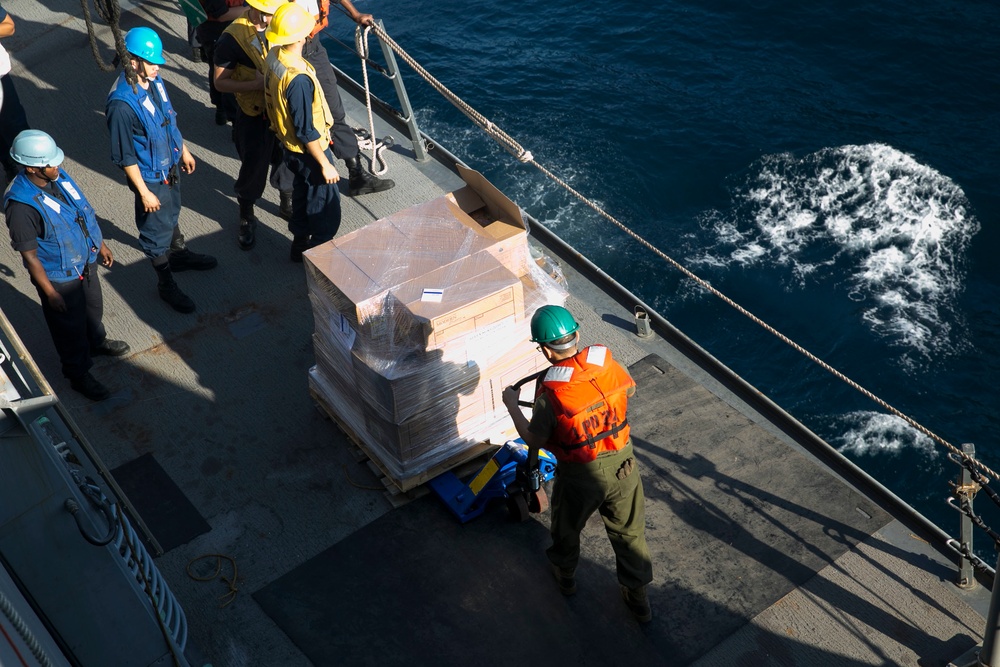 Marines and Sailors work together during replenishment-at-sea