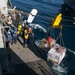 Marines and Sailors work together during replenishment-at-sea