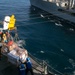 Marines and Sailors work together during replenishment-at-sea