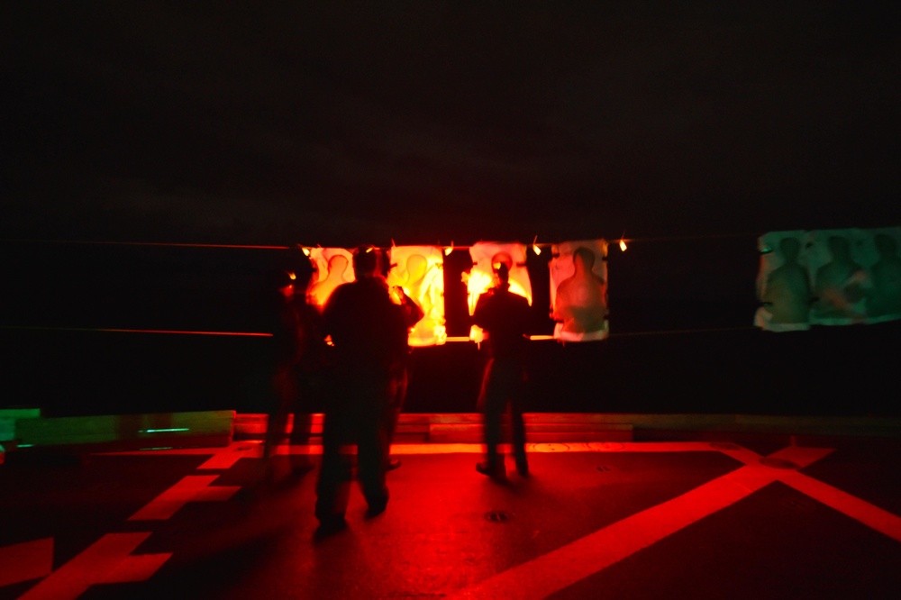 Low-light small-arms qualifications aboard USS Ross