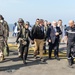 Secretary of defense and his wife, Stephanie, arrive on the deck of the flagship of the French Navy, the Charles De Gaulle