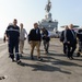 Secretary of defense departs the deck of the flagship of the French Navy, the Charles De Gaulle