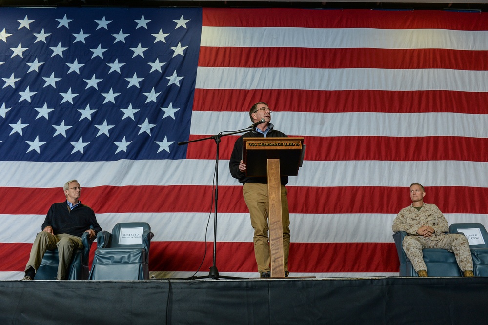 Secretary of defense addresses Sailors and Marines during an all-hands call in the hangar bay aboard the amphibious assault ship USS Kearsarge