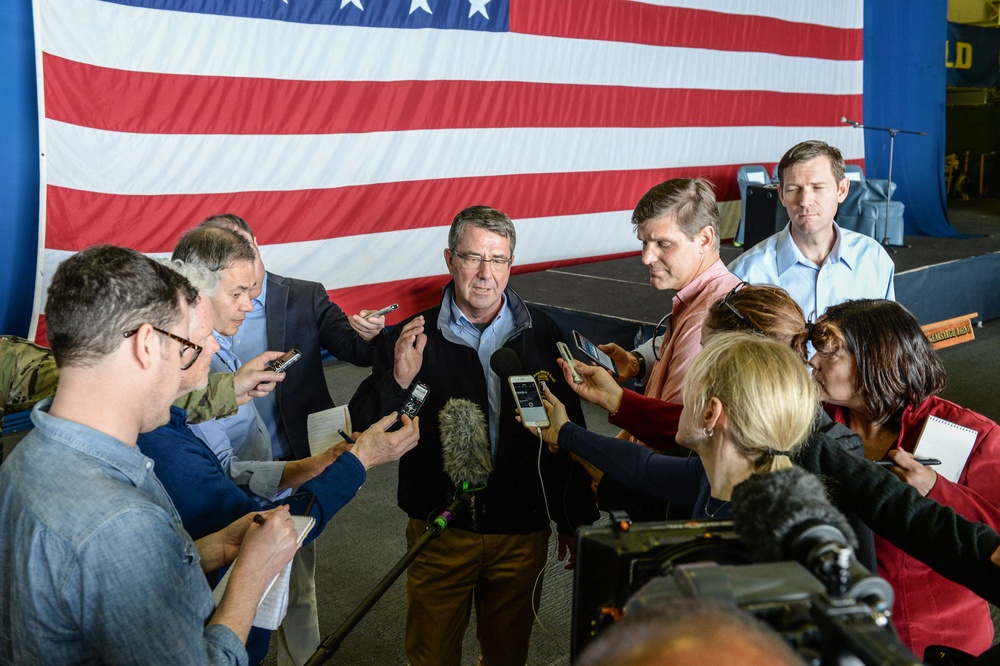 Secretary of defense holds a press conference below deck of the USS Kearsarge