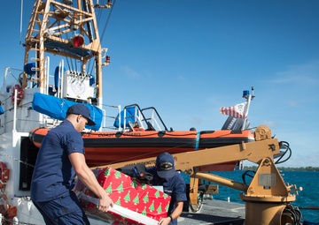 Crew members assigned to USCGC Washington (WPB-1331) participate in Operation Christmas Drop