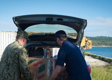 Crew members assigned to USCGC Washington (WPB-1331) participate in Operation Christmas Drop