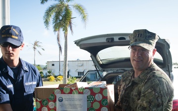 Crew members assigned to USCGC Washington (WPB-1331) participate in Operation Christmas Drop