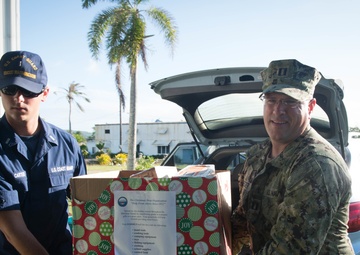 Crew members assigned to USCGC Washington (WPB-1331) participate in Operation Christmas Drop