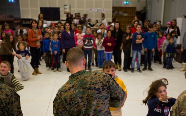 U.S. military members celebrate Christmas early with Romanian children