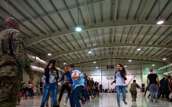 U.S. military members celebrate Christmas early with Romanian children