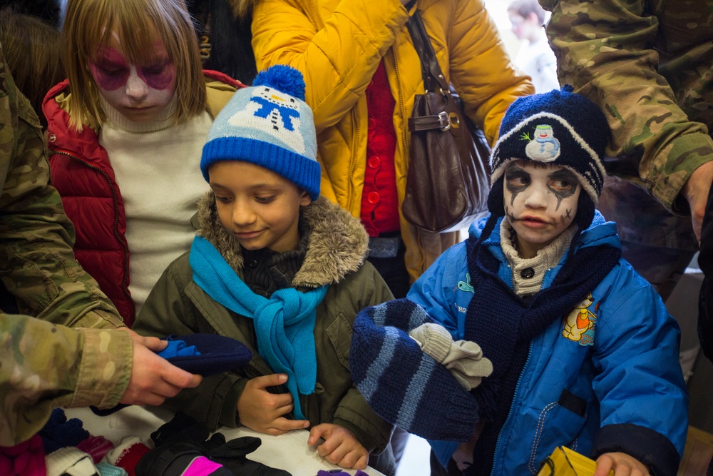 U.S. military members celebrate Christmas early with Romanian children