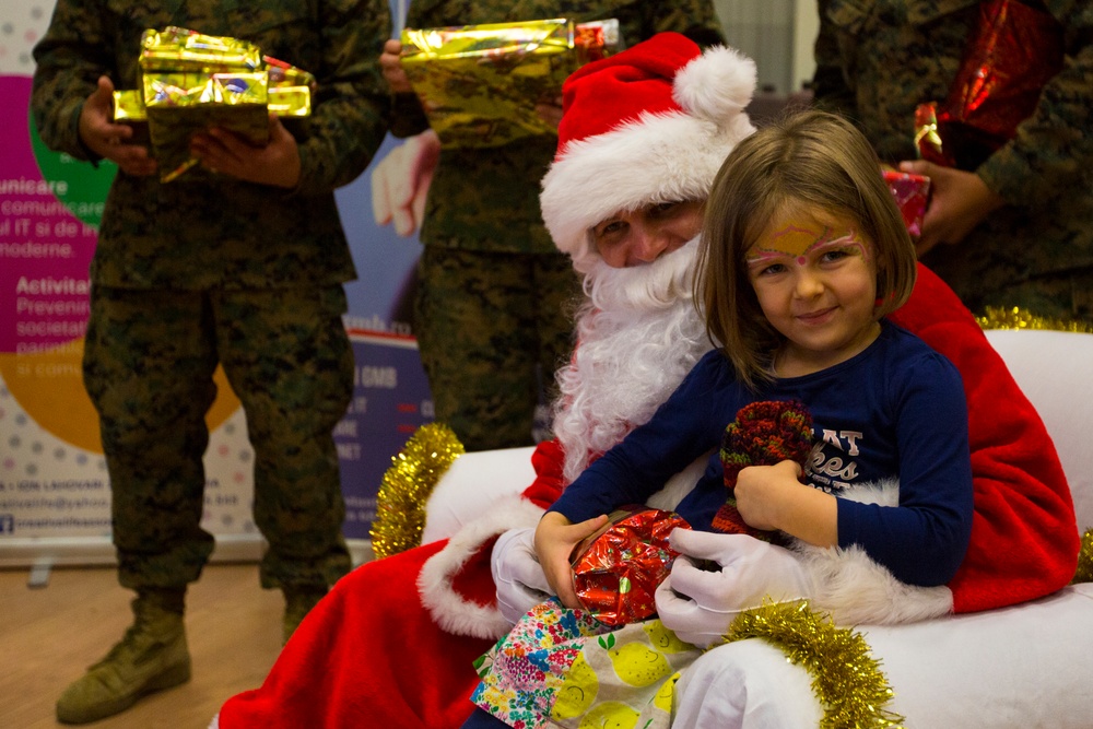 U.S. military members celebrate Christmas early with Romanian children