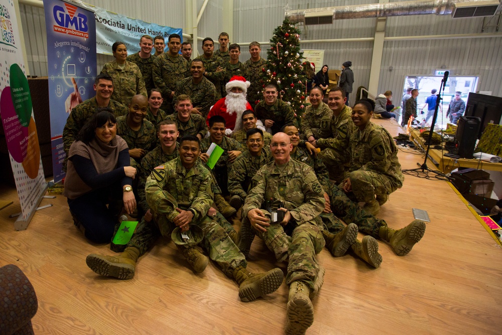 U.S. military members celebrate Christmas early with Romanian children