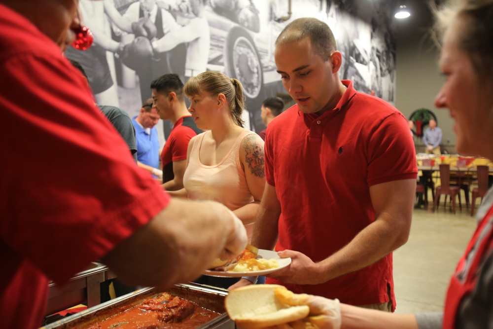 Senior leaders serve home cooked meals for troops staying back