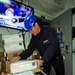 USS Blue Ridge sailor sorts packages