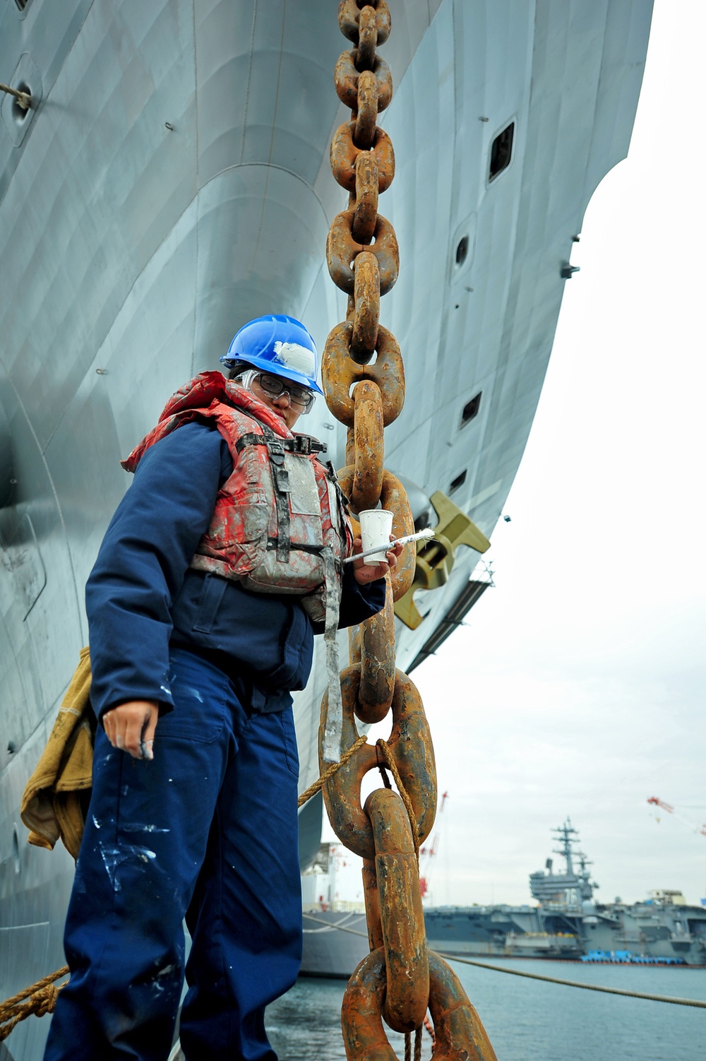 USS Blue Ridge sailor poses near anchor chain