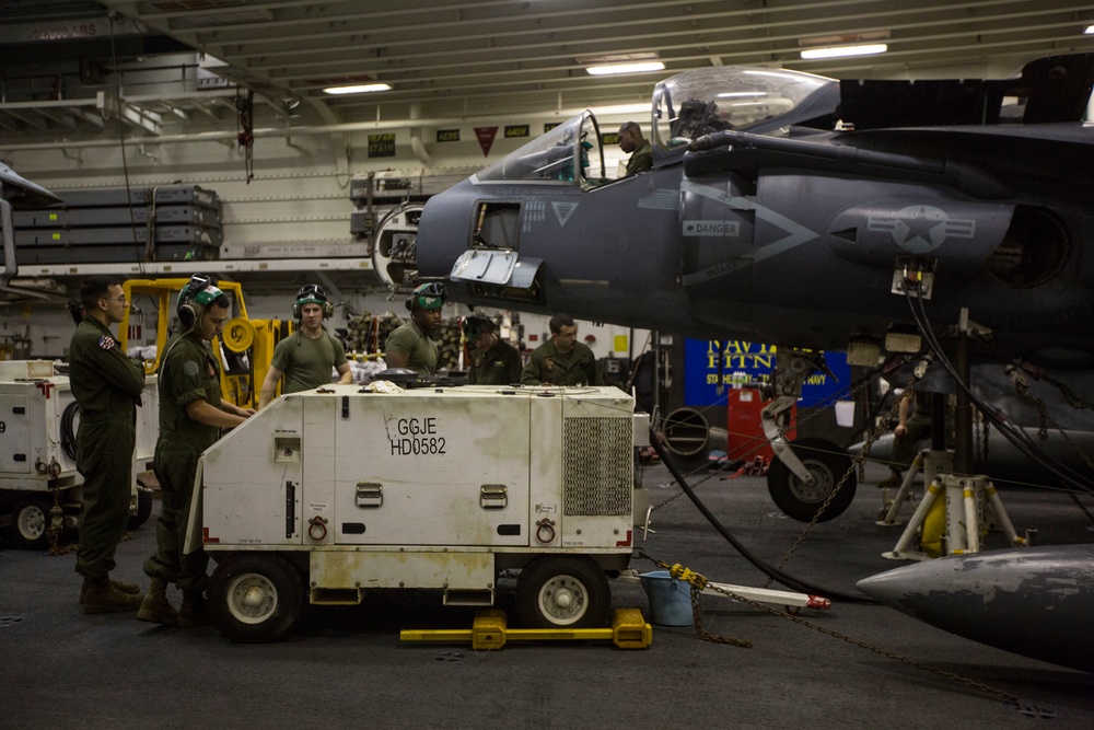 26th MEU Marines conduct maintenance on an AV-8B Harrier