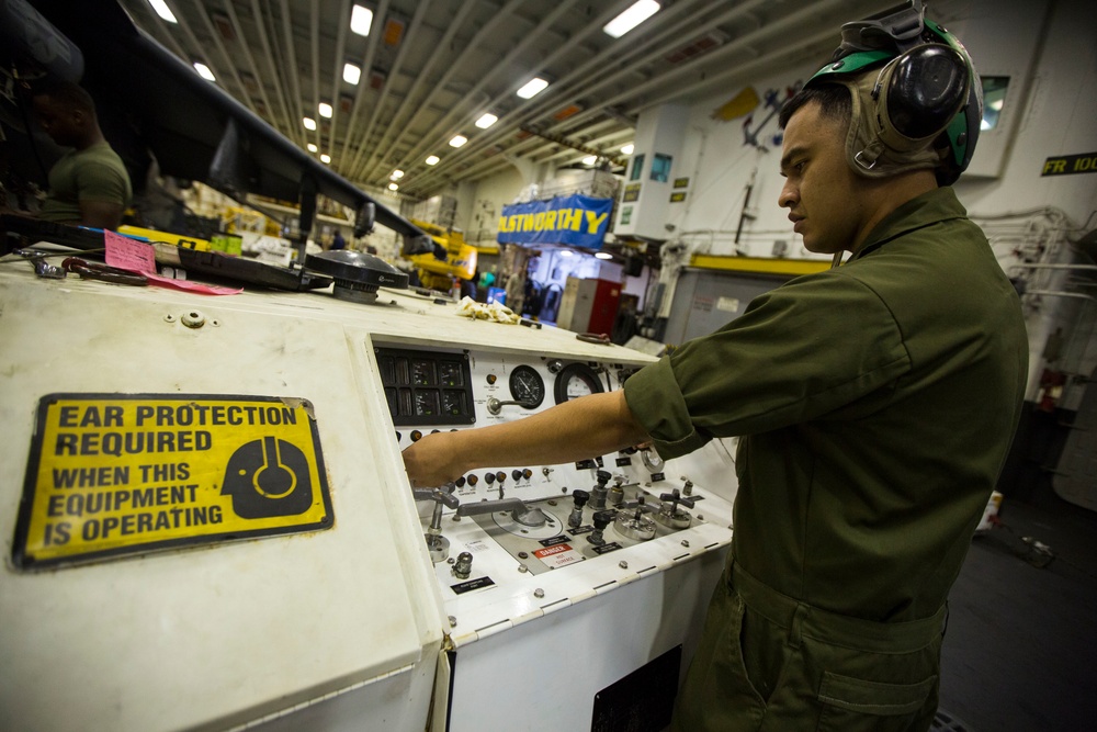 26th MEU Marines conduct maintenance on an AV-8B Harrier