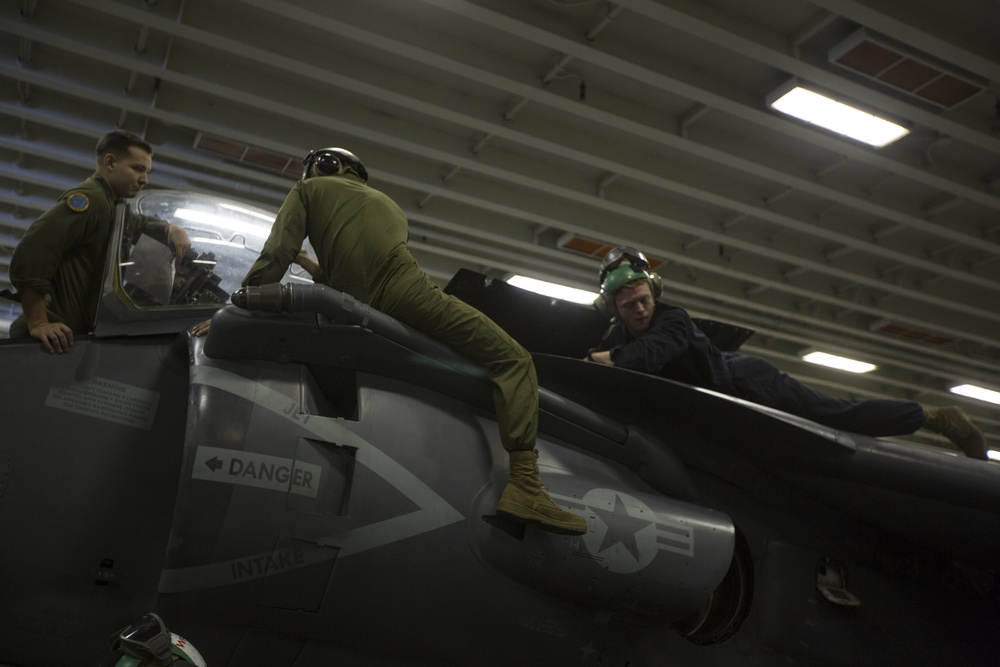 26th MEU Marines conduct maintenance on an AV-8B Harrier