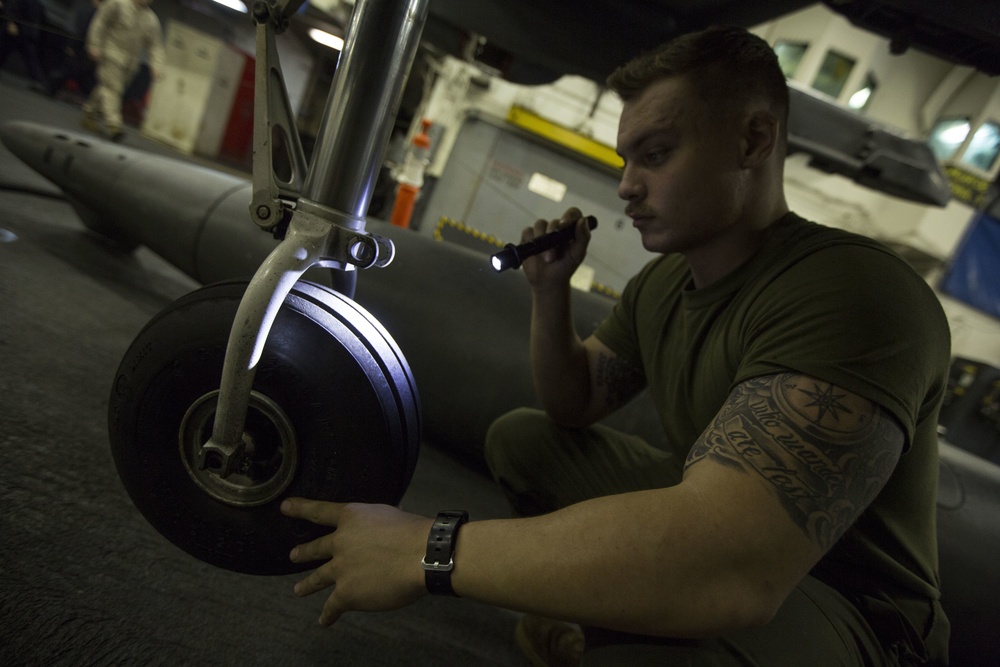 26th MEU Marines conduct maintenance on an AV-8B Harrier