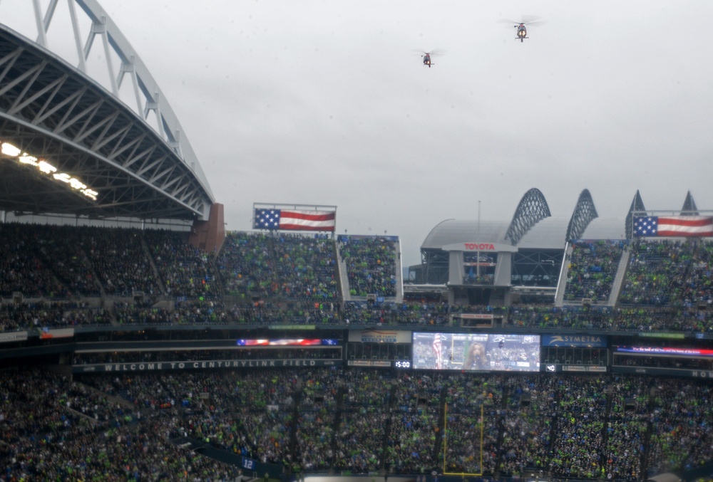 Port Angeles-based Coast Guardsmen fly over Seattle Seahawks game