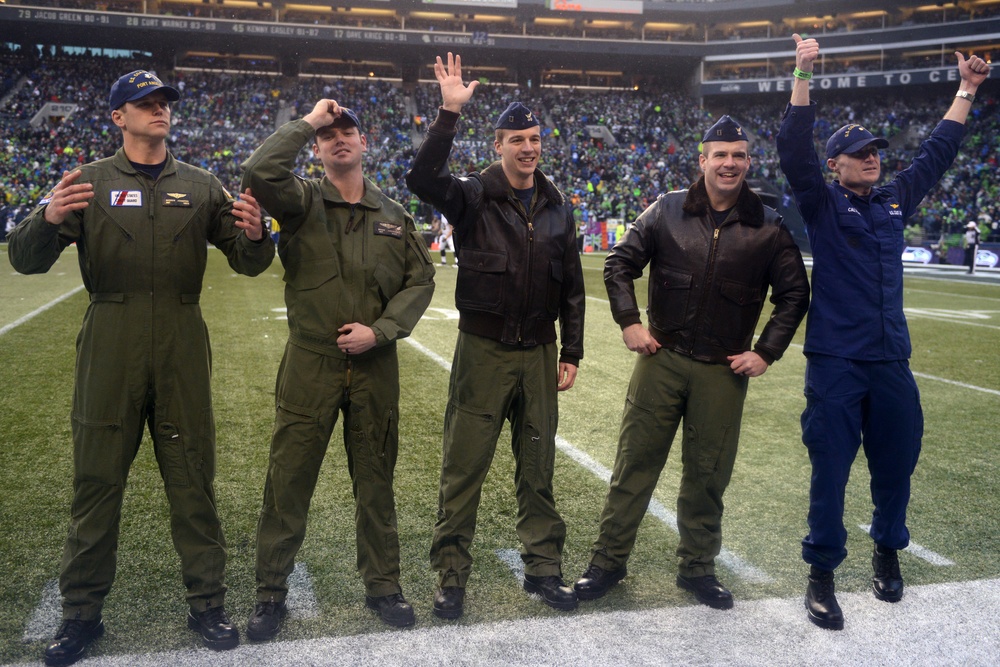 Port Angeles-based Coast Guardsmen fly over Seattle Seahawks game